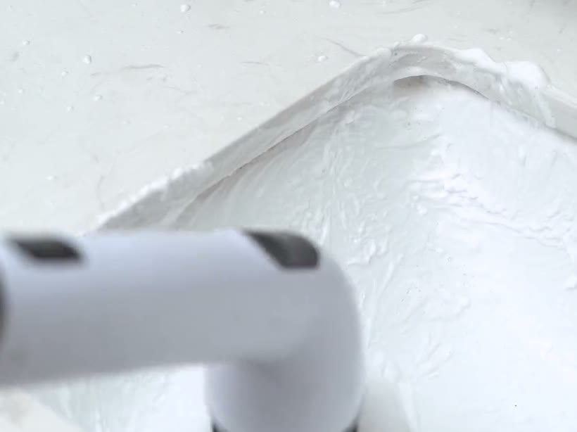 Bathroom sink while the TUYU spin scrubber scrubs
